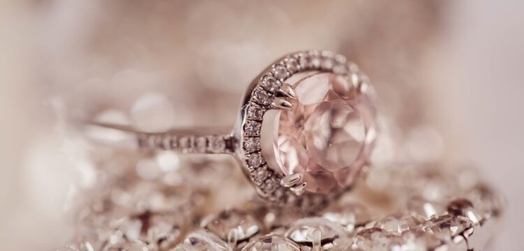 A round diamond engagement ring.
