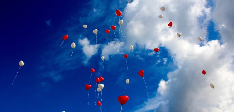 Heart balloons floating in the sky.