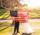 Bride and groom with American flag