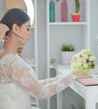 bride makeup artist with hair styling